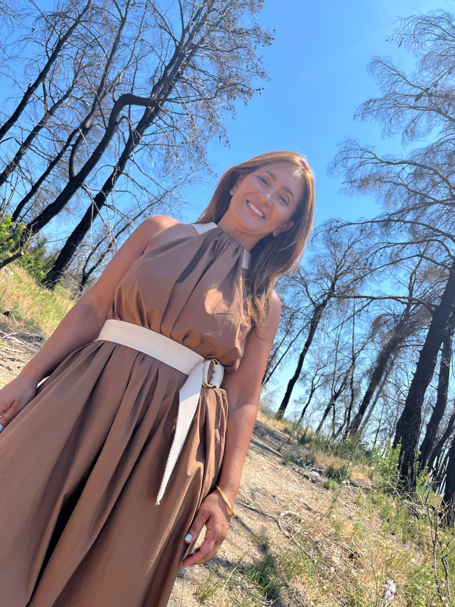 Efthymia Baxevani Life Coach – Smiling outdoors in nature for About page